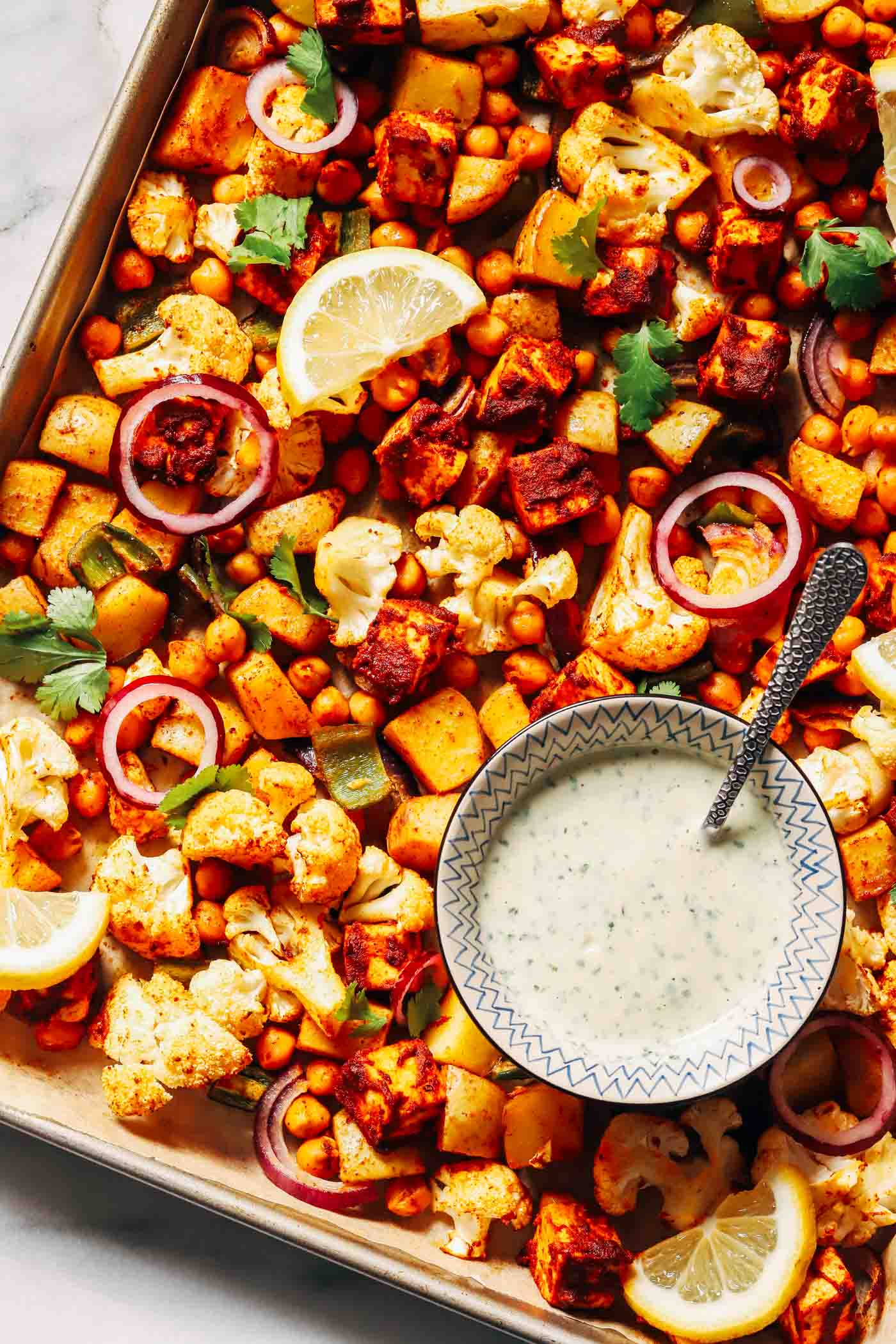 Sheet Pan Chickpea Tikka with Lemon-Ginger Yogurt Sauce - Making Thyme for Health